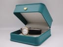 The Tissot Stylist watch presented open in a green non-original gift box