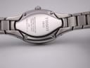 Close-up of the watch case back, engraved with "TISSOT 1853", "WATERRESISTANT 30M", "SAPPHIRE CRYSTAL", "STAINLESS STEEL", "L720", and serial number "TKM-BB-97381 S".