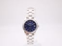 Front view of Tissot PR 50 ladies watch with blue dial, silver hands, and stainless steel bracelet.