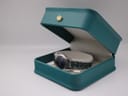 The Tissot PR 50 watch resting inside a green Tissot presentation box with a cream interior.