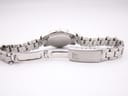 Underside view of the Tissot PR 50 stainless steel bracelet, revealing the fold-over clasp mechanism with the 'T' logo.