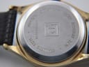 Close-up of the brushed stainless steel case back, engraved with 'TISSOT', 'WATER RESISTANT 30 M', 'MINERAL CRYSTAL', 'STAINLESS STEEL', and 'B935A / 1945A'.