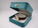 Tissot Seastar watch placed inside an open green Tissot presentation box with a gold crown logo.