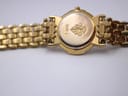 Close-up of the gold plated case back of the Gucci 3400L, showing the '3400 L' engraving and the embossed Gucci crest.