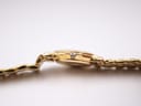 Side profile of the Gucci 3400L watch, featuring the original signed crown with the 'G' logo.