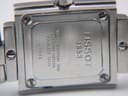 Close-up of the watch case back, engraved with "TISSOT 1853", "WATERRESISTANT 30M", "SAPPHIRE CRYSTAL", "STAINLESS STEEL", and "L 730 K".