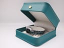 The Tissot T-Trend watch resting inside a teal-coloured non-original presentation box with a cream interior.