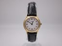 Front view of gold plated Tissot F300 ladies' watch with white dial and black alligator calf grain strap.