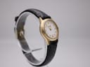 Another angled side view of the Tissot F300 watch, highlighting the white dial and strap texture.