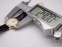 Digital caliper measuring the Tissot F300 case diameter, displaying 24.00mm.
