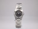 Front view of Tissot T-Trend L520 ladies' watch with black dial and polished stainless steel bracelet.