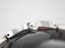 Macro shot of the Tissot signed crown with the distinct 'T' logo.