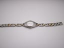 Overhead view of the Tissot T-Trend watch laid flat, displaying the full length of the two-tone stainless steel bracelet.