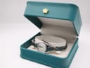 The Tissot T-Trend watch resting inside a teal-coloured non-original presentation box.