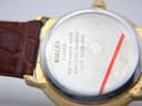 Close-up of the watch case back, showing 'BASE METAL BEZEL STAINLESS STEEL BACK WATER RESISTANT 30M QUARTZ 47/7359' engravings.