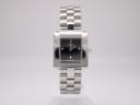 Front view of Tissot T-Trend ladies' square watch with black dial and silver stainless steel bracelet.