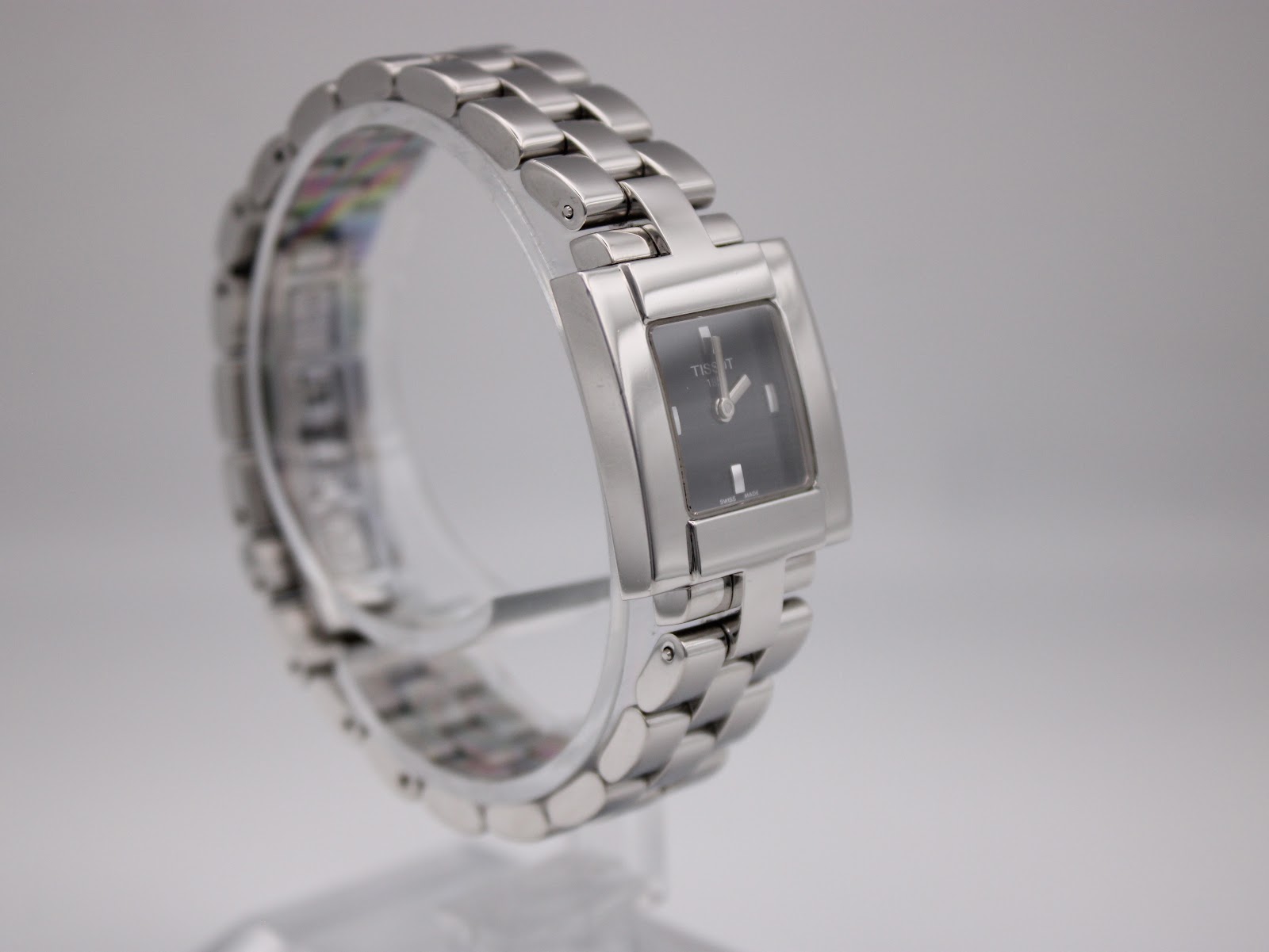 Another angled side view of the Tissot T-Trend watch, highlighting the integrated bracelet design.