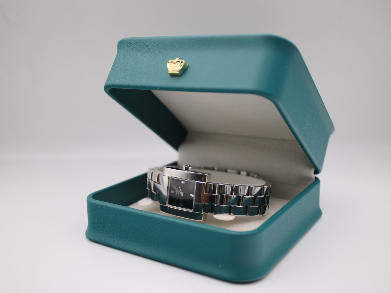 The Tissot T-Trend watch presented inside a green Tissot brand display box with a gold crown emblem on the lid.