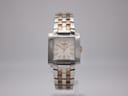 Front view of the Tissot T-Trend ladies' watch, featuring a white dial, gold-tone hands, and a two-tone stainless steel bracelet.