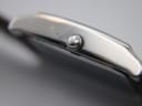 Macro shot of the watch crown, featuring the embossed Bulova tuning fork logo.