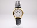 Front view of the gold plated Tissot C226K ladies' watch with a white dial, Roman numerals, and a black croc-effect leather strap.