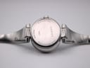Close-up of the watch case back showing 'STAINLESS STEEL', 'GUCCI', '134.5', 'WATER RESISTANT 5 ATM', and 'SWISS MADE' engravings.