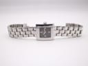 Overhead view of the Tissot L730K watch with its integrated multi-link bracelet laid flat.