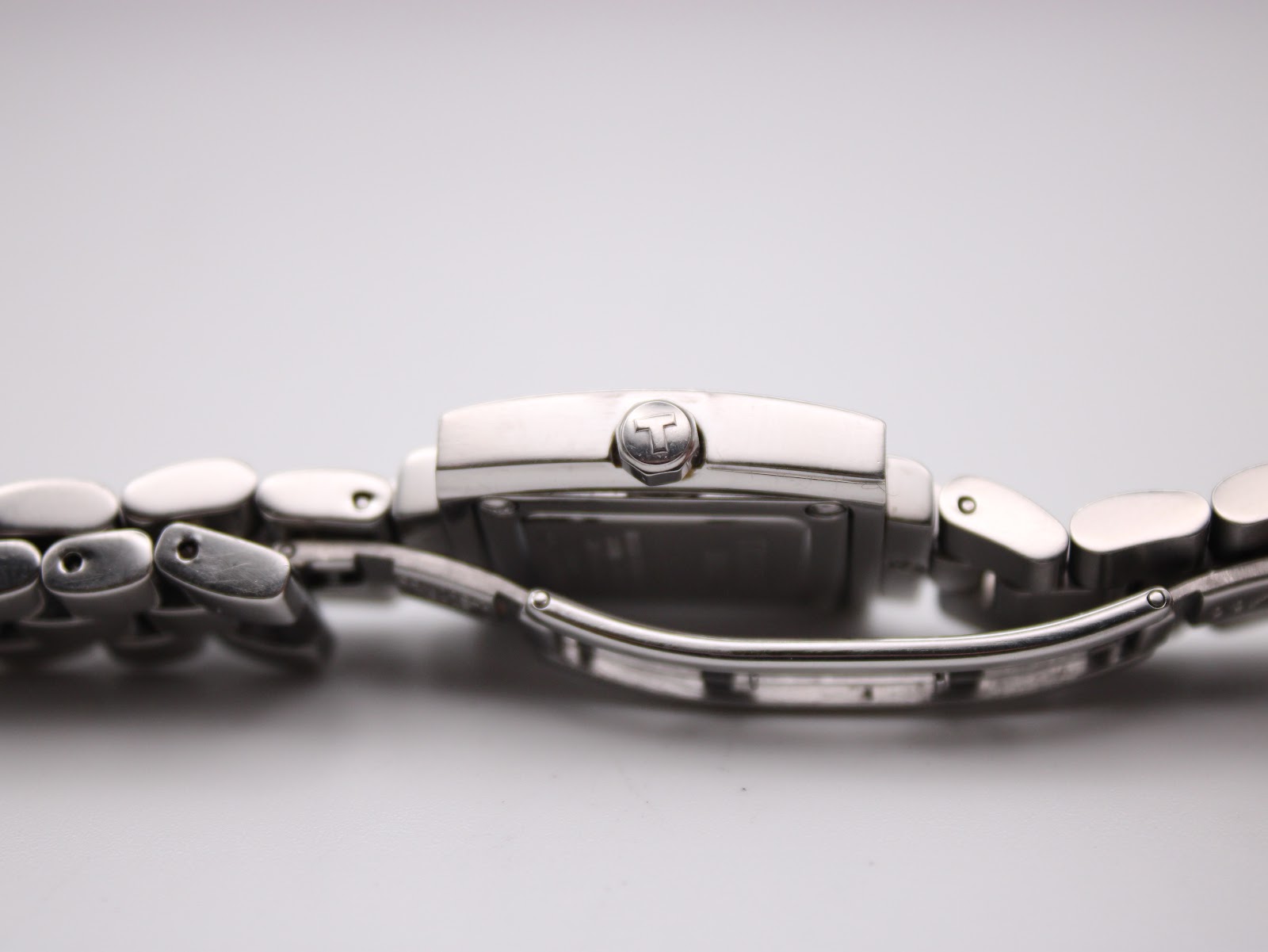 Side profile view of the Tissot L730K watch, showing the sleek lines of the case and bracelet.