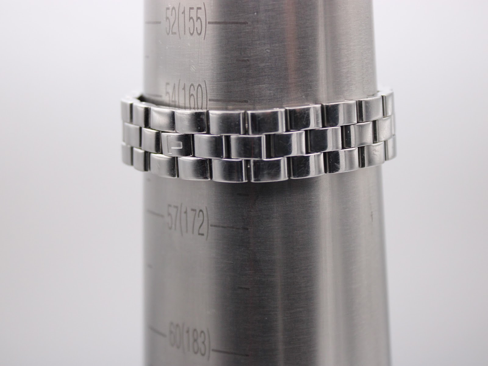 The Tissot L730K watch bracelet wrapped around a wrist sizing cone, indicating a wrist circumference of approximately 17.2cm.