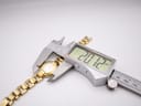Digital caliper measuring the case diameter of the Tissot watch, displaying a precise measurement of 20.12mm.
