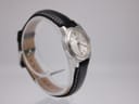 Angled view of the Tissot J326426 watch, highlighting the case profile and the black leather strap.