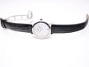 Overhead view of the Tissot T023210A watch with its black leather strap laid flat and the butterfly deployment clasp open.