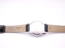 Back view of the Tissot watch strap and case back, showing 'TISSOT 1853' and strap markings '14-12' on the leather.