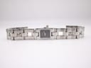 Top-down view of the Gucci 2300L watch with its stainless steel link bracelet laid flat.