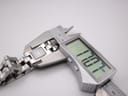 Close-up of a digital caliper measuring the case diameter of the Gucci 2300L, showing a reading of 17.07mm.