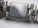 Close-up of the case back engraving on the Gucci 2300L, showing 'GUCCI 2300L SWISS MADE STAINLESS STEEL WATER RESISTANT 3 ATM'.