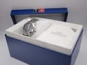The Tissot PRC 200 watch nestled within its original blue presentation box, with accompanying cushion.