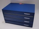 The complete blue Tissot presentation box from an elevated perspective, showing the Tissot branding.