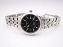 Full view of the Tissot PRC 200 watch with its stainless steel bracelet unfurled, presented on a white background.