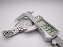 Digital caliper measuring the case diameter of the Tissot PRC 200, showing a precise reading of 39.34mm.