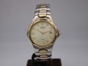 Front view of Citizen quartz two-tone watch with champagne dial and date window at 3 o'clock.