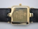 Close-up of the gold-plated case back, showing 'RAYMOND WEIL', 'RW' logo, 'WATERRESISTANT', 'PLAQUE G 10 M', 'SWISS', and model number '5846', with wear marks visible.