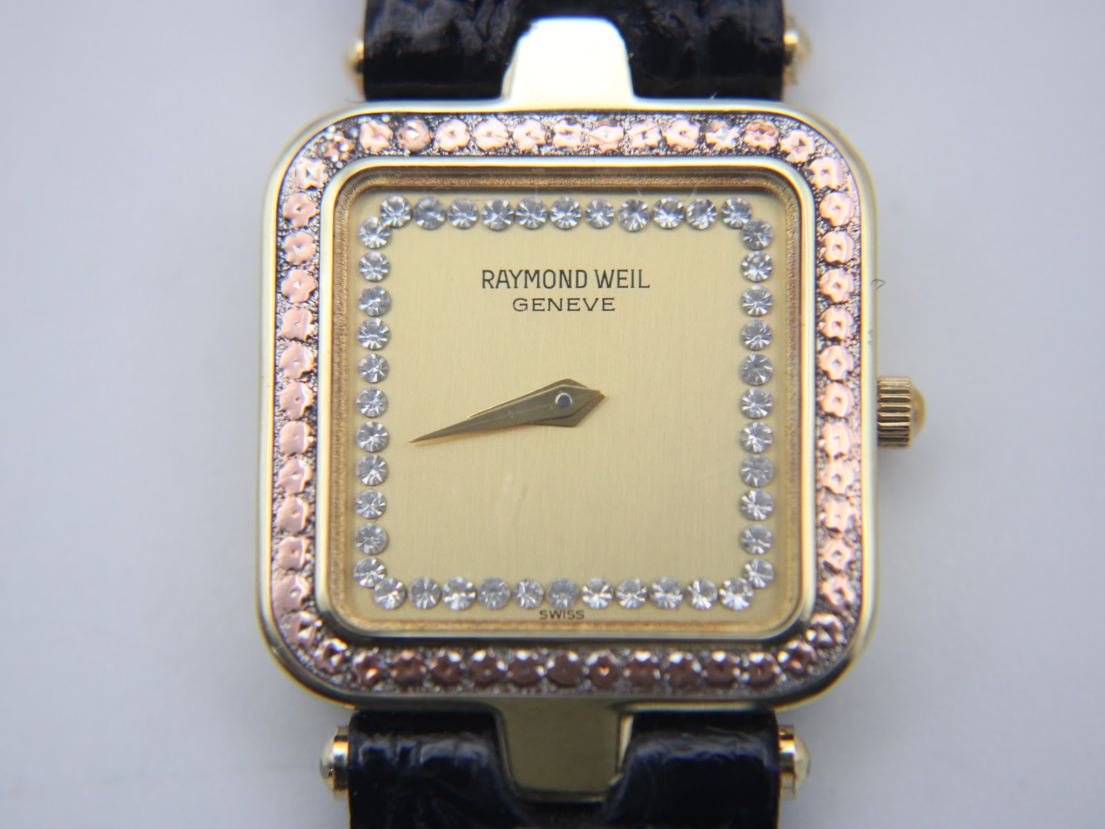 Another close-up, straight-on view of the Raymond Weil dial, highlighting the individual crystals.