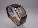 Oblique right side view of the Raymond Weil 9118, highlighting the asymmetric grey pinstripe dial and gold-tone hands.