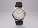 Front view of Seiko 5Y39-7220 gold-tone dress watch with white Roman numeral dial and black leather strap.