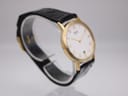 Close-up of the black leather strap and gold-tone buckle on the Seiko dress watch.